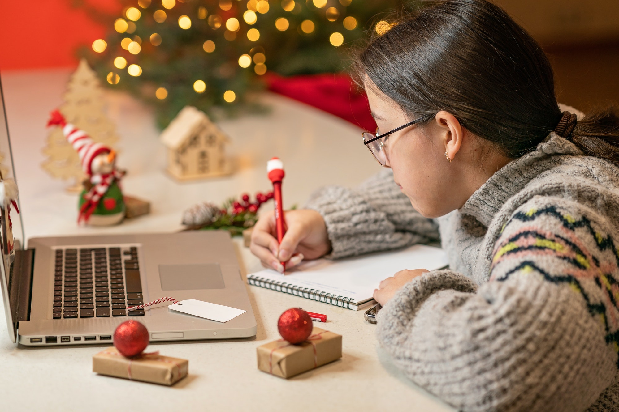 girl writes goals and plans for the new year 2024