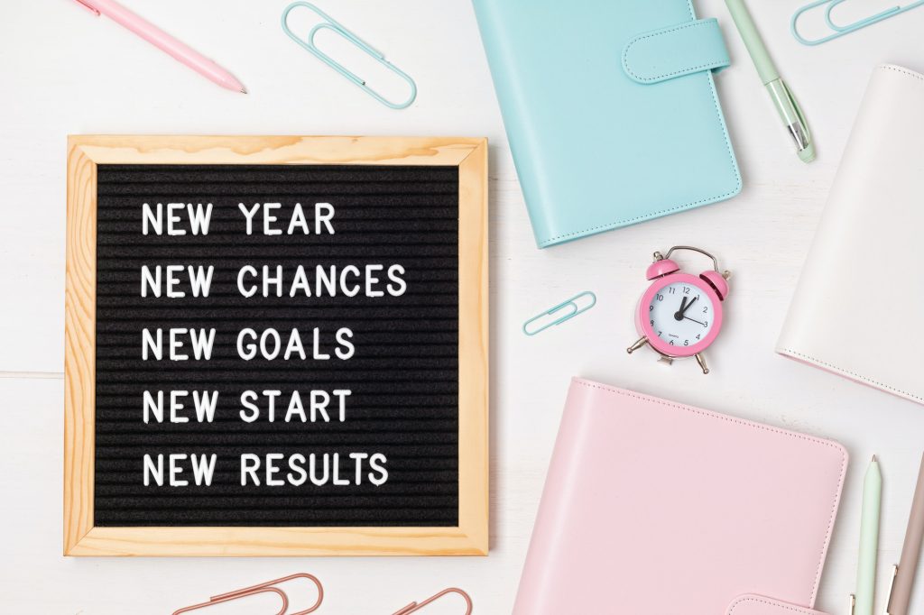 Letter board with motivation text new year, chances, goals, start, results. New year celebration