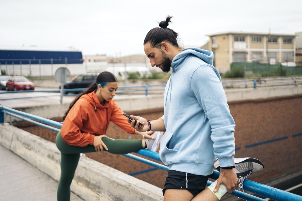 Fitness Man Using Mobile Phone